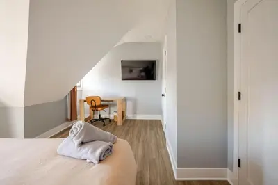 a bedroom with a bed and a desk at Lrg 2 Bedroom apart in BlackRock in Bridgeport