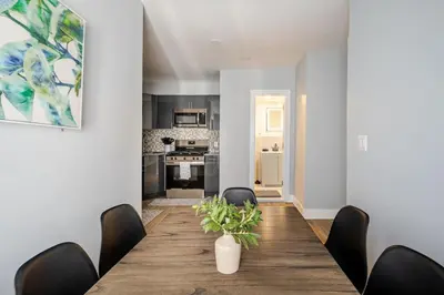 a dining room with a table and chairs at Lrg 2 Bedroom apart in BlackRock in Bridgeport