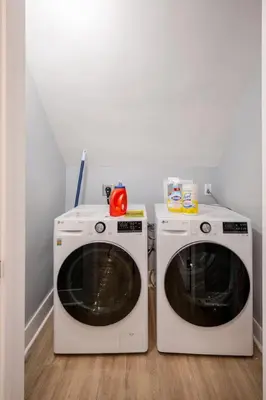 two washing machines sitting next to each other in a room at Lrg 2 Bedroom apart in BlackRock in Bridgeport