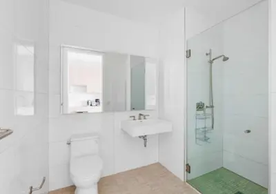 a bathroom with a toilet and a sink and a shower at Awesome Sunny Studio! Best Location! in New York