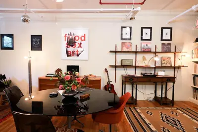a dining room with a table and a desk at Artistic Vintage Loft in Williamsburg in Brooklyn