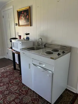a kitchen with a stove and a sink at Room in Lake Home - 2BR 1BA Kitchenette in Greenwich