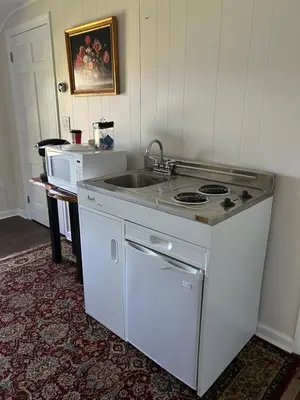 a kitchen with a stove and a sink at Room in Lake Home - 2BR 1BA Kitchenette in Greenwich