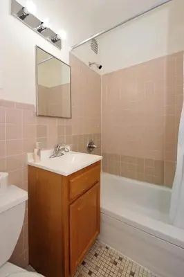 a bathroom with a sink and a tub and a toilet at Amazing Upper East Side Studio! Epic Location!, June To Aug 90 Days Stay Required in New York