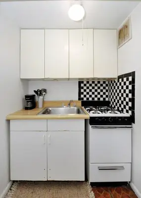 a white kitchen with a sink and a stove at Furnished Apartment Room Rental In NYC, June To Aug 90 Days Stay Required in New York