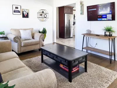 a living room with a coffee table and a couch at Spacious 2-BR 1-Bath King suite! in Plainville