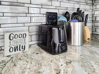 a coffee maker sitting on a counter next to a coffee pot at Spacious 2-BR 1-Bath King suite! in Plainville