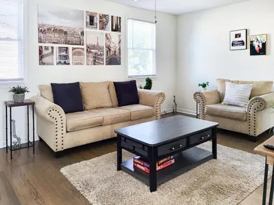 a living room with a couch and a coffee table at Spacious 2-BR 1-Bath King suite! in Plainville