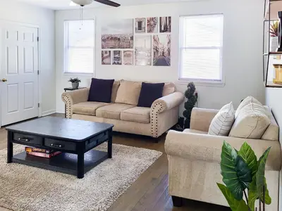 a living room with two couches and a coffee table at Spacious 2-BR 1-Bath King suite! in Plainville