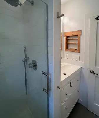 a bathroom with a shower and a sink at Phoenicia Bungalow in Phoenicia