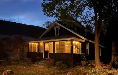 a house with lights on the front of it at Phoenicia Bungalow in Phoenicia