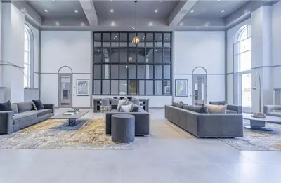 a large living room with couches and a table at Queens Studio Jewel Luxury and Comfort Combined in Mary Immaculate Hospital Heliport