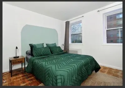 a bedroom with a green bed and a window at Four Bedroom Prime Furnished Rental, June To Aug 90 Days Stay Required in New York
