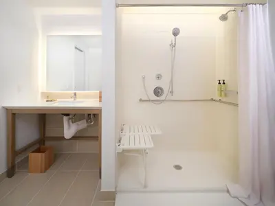 a white bathroom with a sink and a shower at Element Lenox Berkshires in Lenox