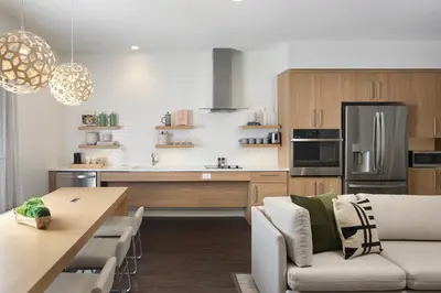 a kitchen and living room with a couch and a table at Element Lenox Berkshires in Lenox