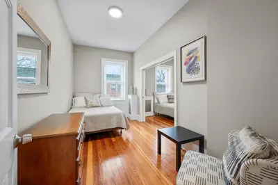 a living room with a couch and a table at Luxury Townhouse in NYC in New York