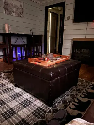 a brown leather couch sitting in a living room at Walnut Grove in Ashland