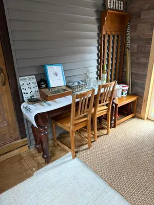 a room with a table and chairs and a piano at Walnut Grove in Ashland