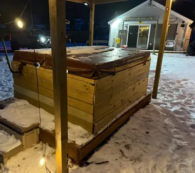 a stack of wooden pallets in the snow at Walnut Grove in Ashland