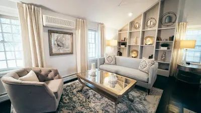 a living room with two chairs and a coffee table at Butter Milk Falls Inn and Spa in Milton