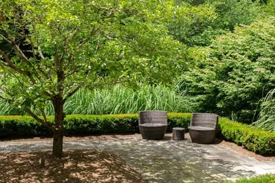 a park with a tree and three trash cans at Butter Milk Falls Inn and Spa in Milton
