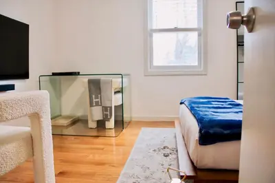 a room with a bed and a glass case at Country House in Waterbury