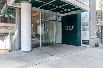 a store front with glass doors on a building at Blueground Midtown S gym roof nr Times Sq NYC-1776 in New York