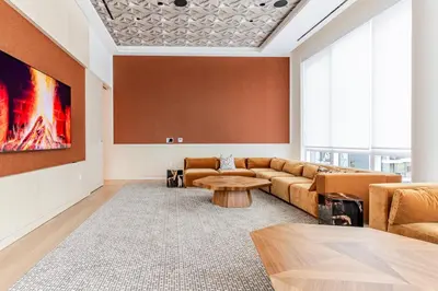a living room with a couch and a table at Blueground LIC gym wd nr MoMA PS1 NYC-1796 in New York
