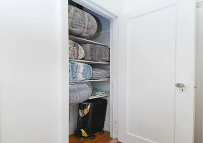 a closet filled with lots of plates and pans at Outdoor Space Washer Dryer Dishwasher 3Beds Apt, June to Aug 90 days stay required in New York
