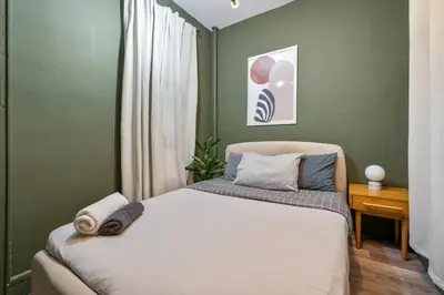 a bedroom with a bed in a green wall at Cozy 2BR in NYC! Lenox Hill!, June to Aug 90 days stay required in New York