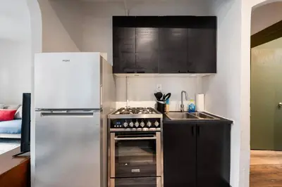 a kitchen with a stove and a refrigerator at Cozy 2BR in NYC! Lenox Hill!, June to Aug 90 days stay required in New York