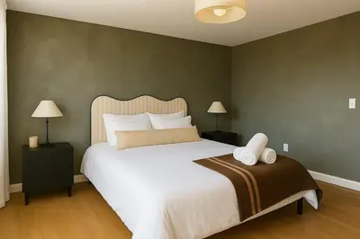 a bedroom with a large white bed and two lamps at Westville Stay 2BR Near Yale in New Haven