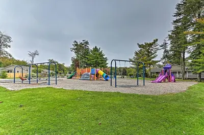a park with a playground with slides at 3 Mi to Tobyhanna State Park Home with Serene Deck! in Tobyhanna