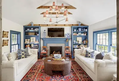 a living room with two white couches and a fireplace at Haddock Cotter Chic Farmhouse and Barn w Pool in Old Chatham