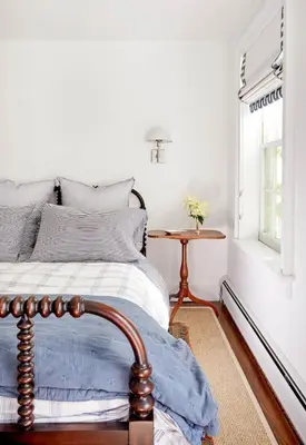 a bedroom with a bed and a table and a window at Haddock Cotter Chic Farmhouse and Barn w Pool in Old Chatham
