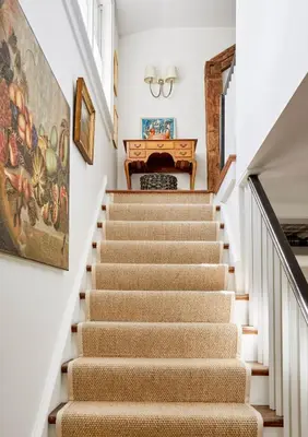 a set of stairs with a piano in a house at Haddock Cotter Chic Farmhouse and Barn w Pool in Old Chatham