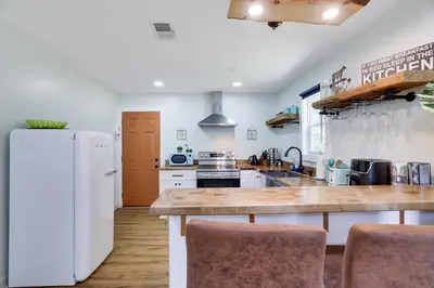 a kitchen with a white refrigerator and a counter at Cozy 2 Bedroom apartment in Tannersville, minutes from Camelback Mountain in Tannersville