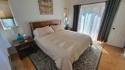 a bedroom with a large bed and a window at Wilderness Getaway in East Jewett