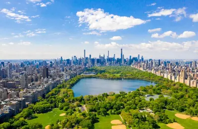 an aerial view of a large city with a lake at Charming 2BR Apartment Near Times Square in New York