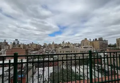a view of a city from a balcony at Charming 2BR Apartment Near Times Square in New York
