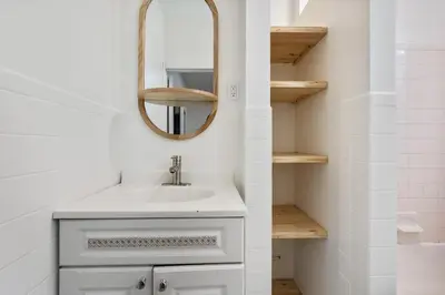 a bathroom with a sink and a mirror at 2BR Upper East Side near Central Park in New York