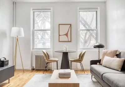 a living room with a couch and a table at Lovely Apt Near Central Park in New York
