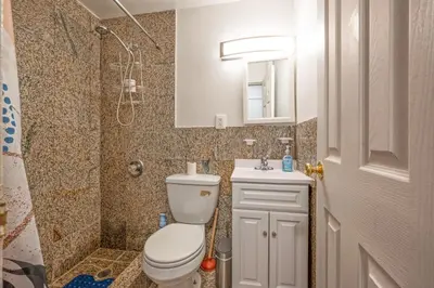 a bathroom with a toilet and a shower and a sink at Amazing Studio in Kips Bay in New York