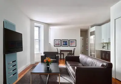 a living room with a couch and a table at XL Prime Tribeca Furnished Loft in New York