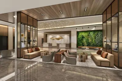 a lobby of a hotel with couches and chairs at The Westin Flushing LaGuardia Airport in Flushing