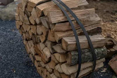 a stack of logs with a hose on it at Modern Retreat Poconos 3BR Fire Pit Skiing in East Stroudsburg