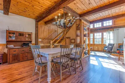 a dining room with a table and chairs at Light-filled Carpenter's Cottage in Stockbridge in Stockbridge