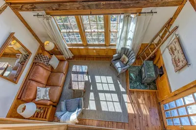 an overhead view of a living room in a house at Light-filled Carpenter's Cottage in Stockbridge in Stockbridge