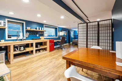 a kitchen with a table and a dining room at The Hygge Way, 20MIN TO NYC Times Sq in North Bergen