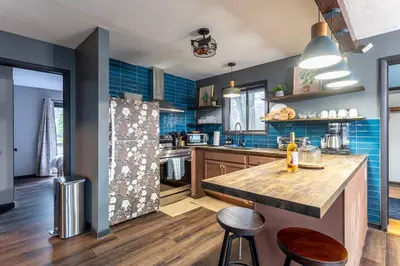 a kitchen with a large island in the middle at Water Front Dream Hot Tub Fire Pit King Bed in Tobyhanna